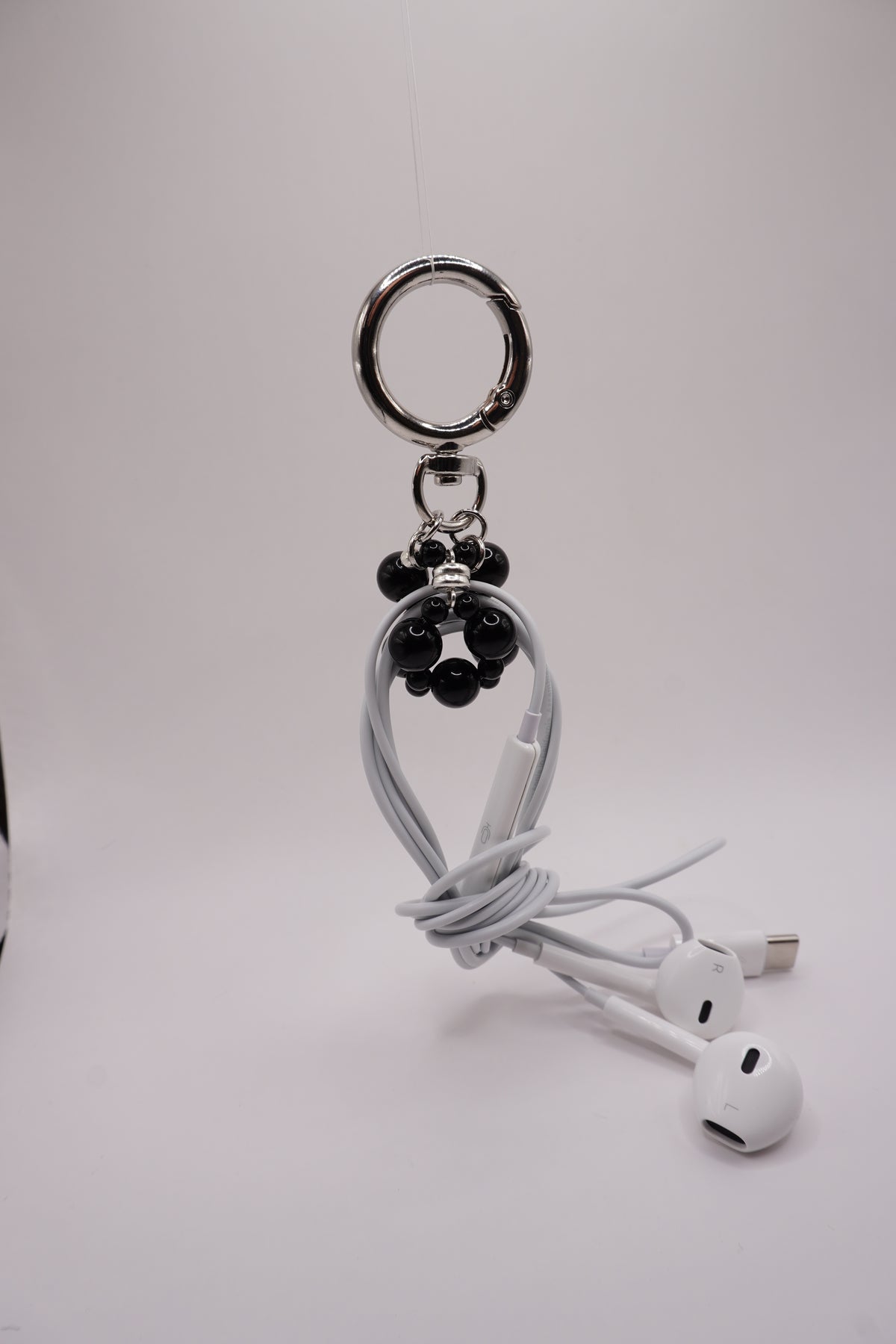 Wired earphone charm